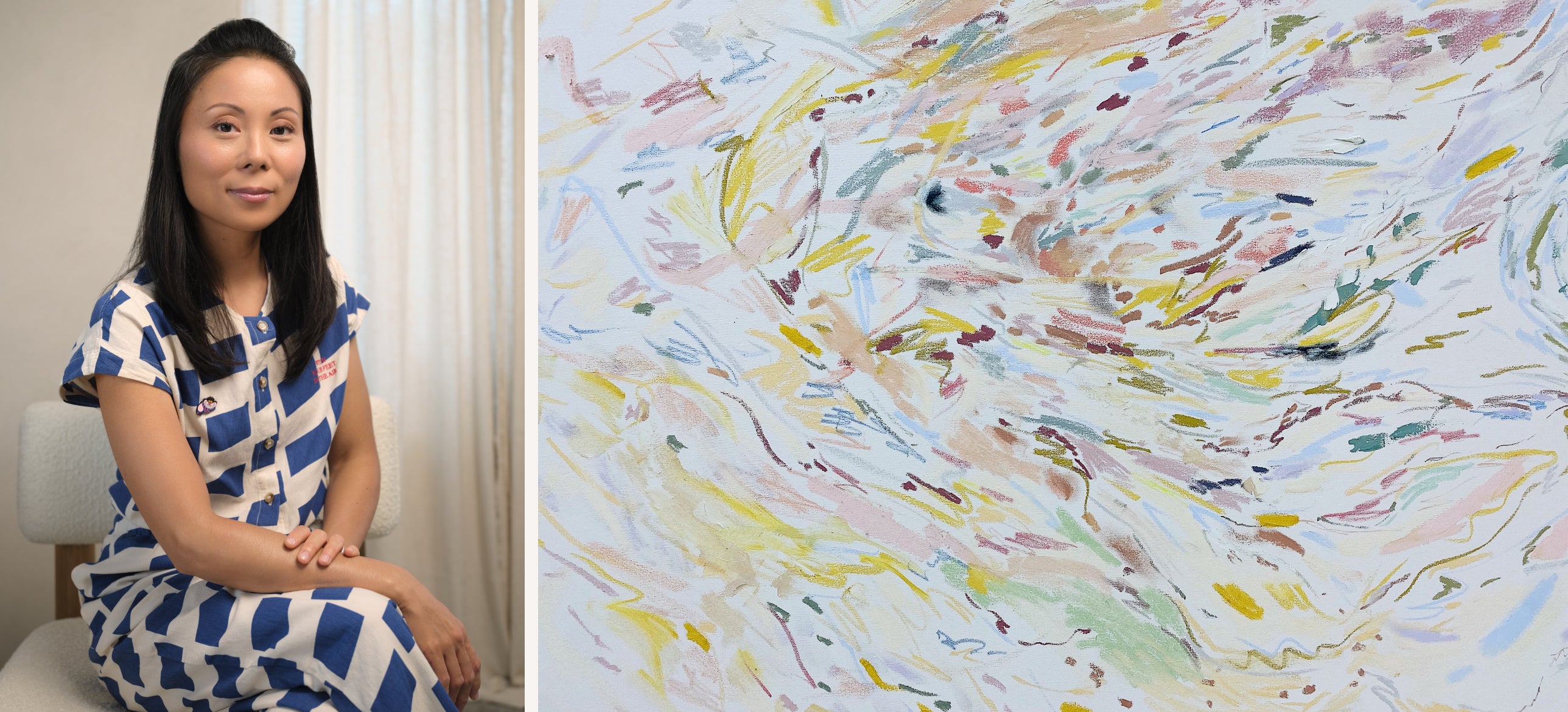 Artist Satsuki Shibuya poses with a smile in a stylish outfit next to her artwork titled ILIA.